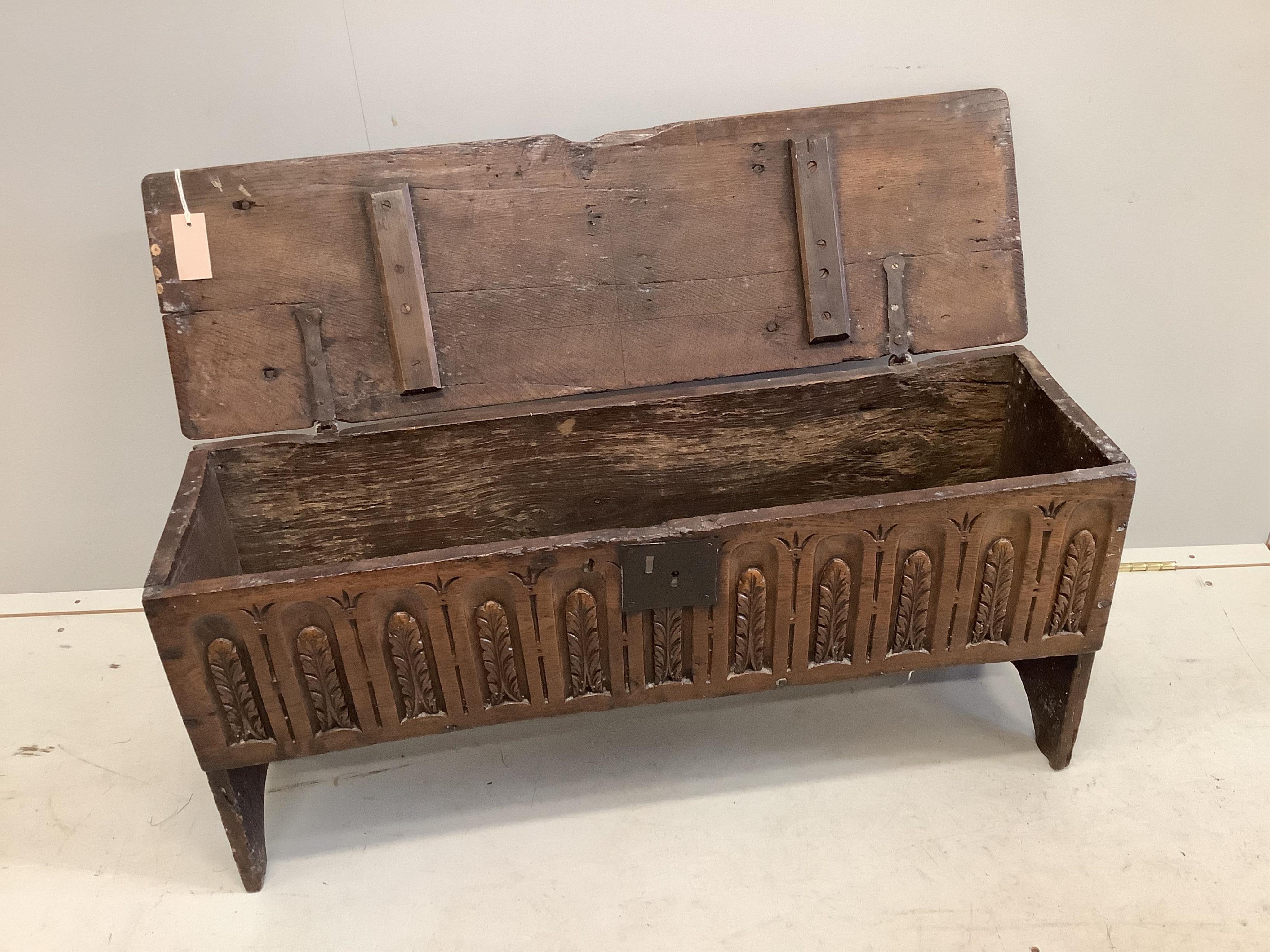 A late 17th century style carved oak six plank coffer, width 96cm, depth 29cm, height 45cm. Condition - fair